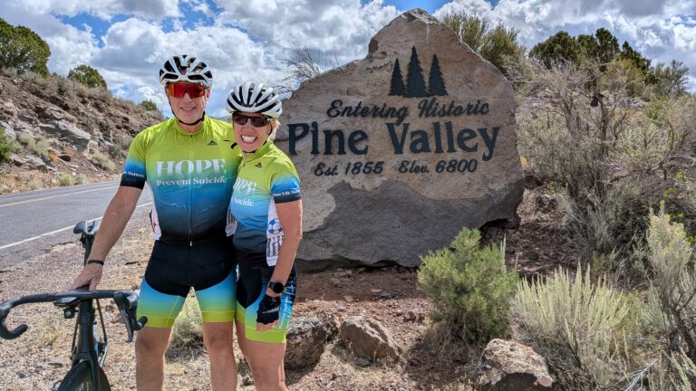 Vision Quest riders at the Pine Valley summit sign